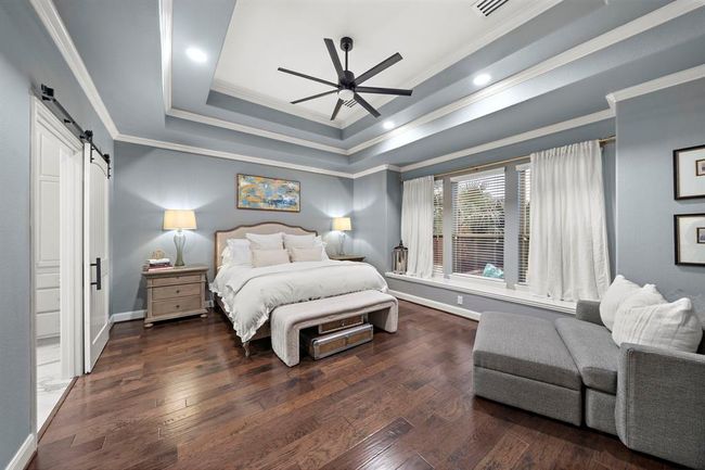The primary suite is a spa-like retreat featuring an oversized shower, soaking tub, custom vanity as well as dream custom walk-in closet. | Image 17