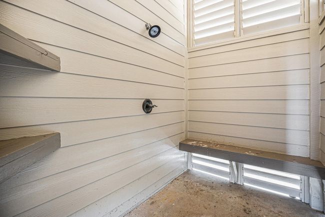 This enclosed outdoor shower offers a convenient and functional way to wash off sand or saltwater before heading inside. | Image 41