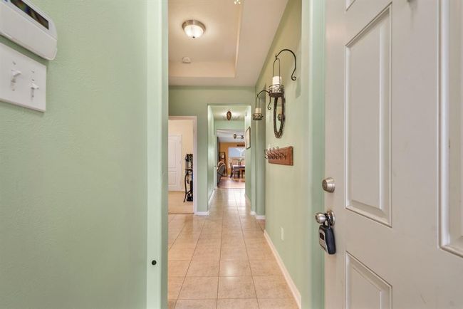 Upon entering the home there is custom paint and tile floors. | Image 4