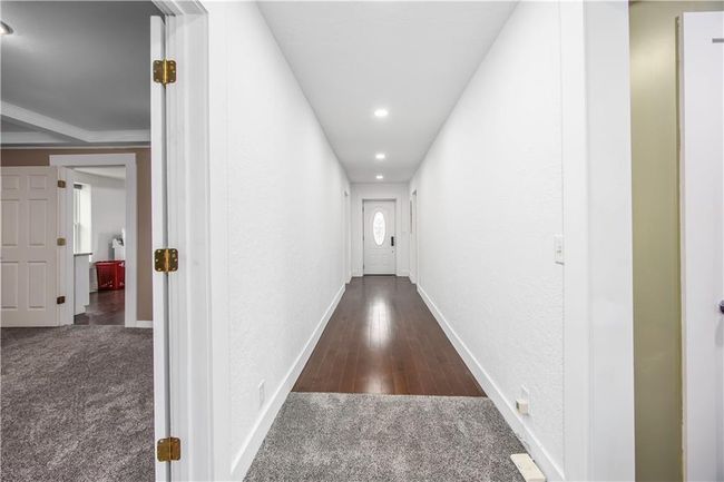 Hall featuring recessed lighting, baseboards, carpet floors, and a textured wall | Image 27
