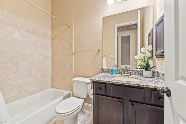Full bathroom between 2 of the bedrooms is also convenient for guests. | Image 10