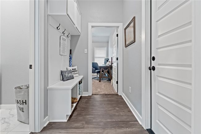 Mudroom featuring baseboards and dark wood finished floors | Image 11