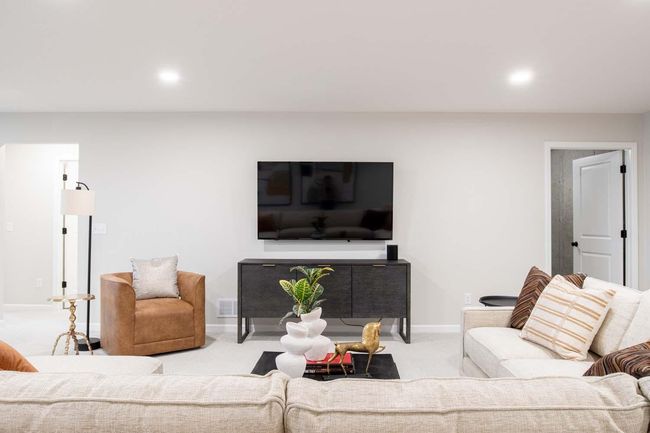 The finished lower level features great space to do a large TV, creating the perfect setting for movie nights or sports gatherings. Photos are from previously built home; options and features will vary. | Image 24