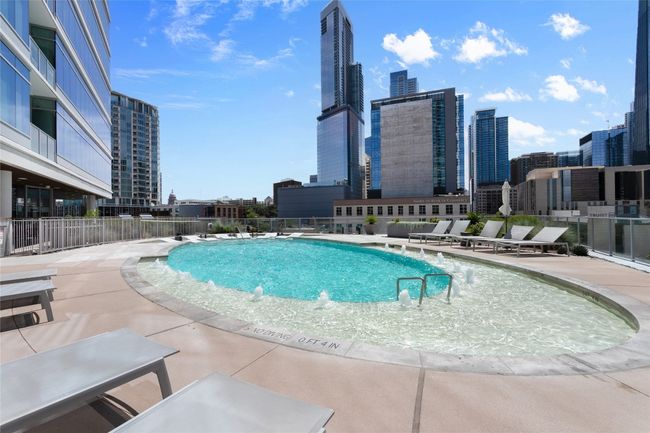 Community pool featuring a view of skyline | Image 30