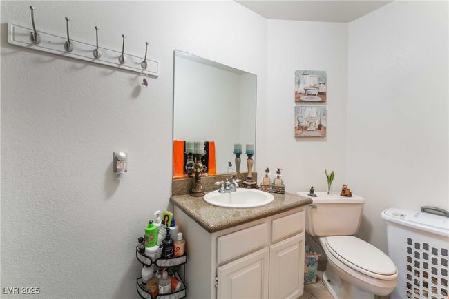 Bathroom featuring toilet, tile patterned flooring, and vanity | Image 34