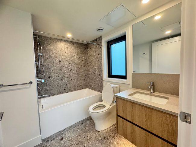 Full bathroom featuring toilet, vanity, shower / bath combination, and recessed lighting | Image 38