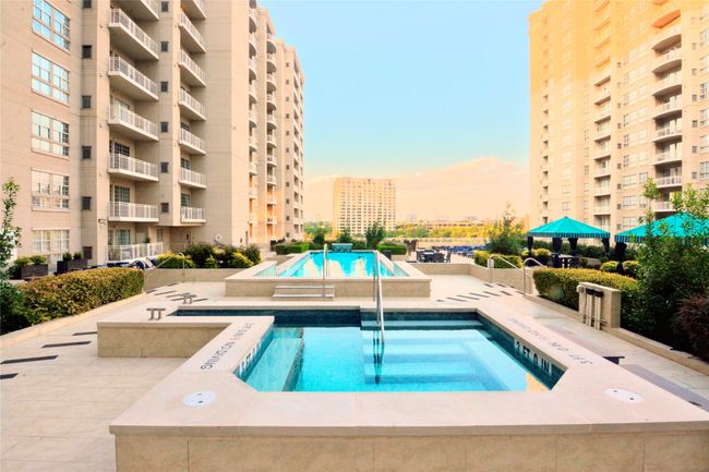 Community pool featuring a hot tub and a patio area | Image 28