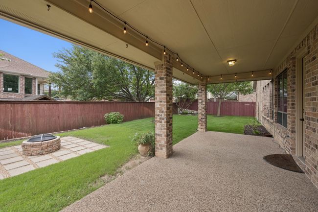 View of patio / terrace featuring an outdoor fire pit | Image 35