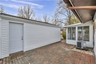 View of patio with central AC and a sunroom | Image 2