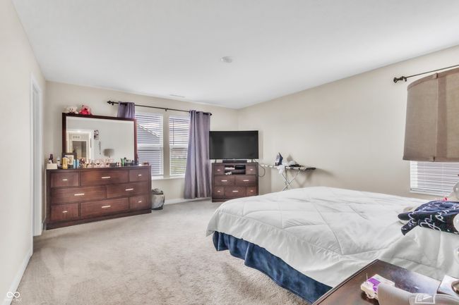 carpeted bedroom with baseboards | Image 18