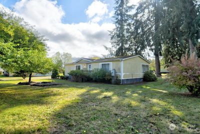 Front of home with pond feature ready for your imagination! | Image 1