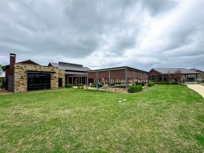 View of yard featuring a garage | Image 25