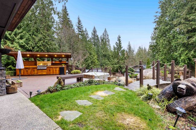 View of yard with a wooden deck and an outdoor kitchen | Image 31