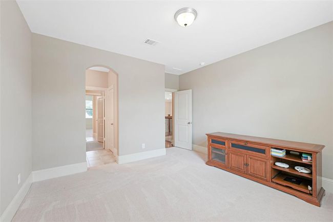ersatile upstairs flex room offers the perfect setting for a game room, media room, or home office. Neutral tones and natural light make it easy to personalize. | Image 39