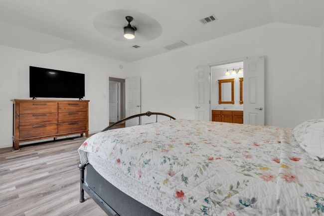 Primary bedroom, 2nd living space just beyond the door, primary bathroom to the right | Image 18
