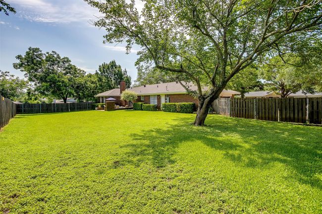 View of fenced backyard | Image 39