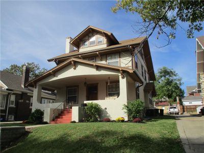 View of front of home with a front lawn and covered porch | Image 1