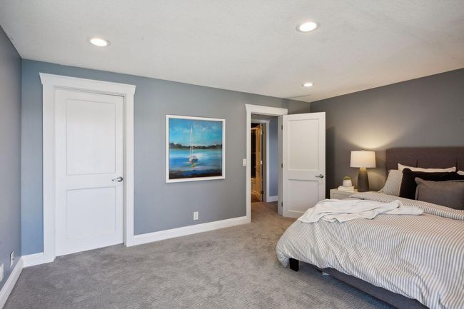 Big walk-in closet in the lower level has closet organizations system to maximize the utility. | Image 26