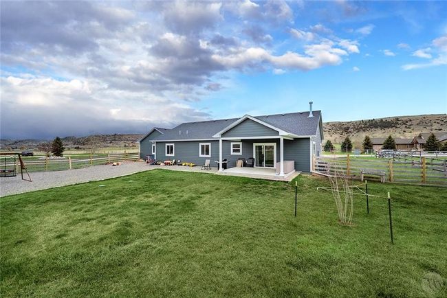Back of the house and fenced in yard. | Image 29