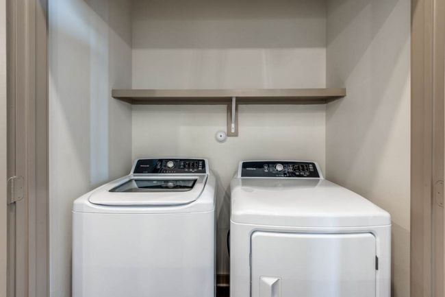 Laundry room featuring independent washer and dryer | Image 14