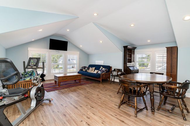 Dining room with lofted ceiling, recessed lighting, and light wood-style floors | Image 27