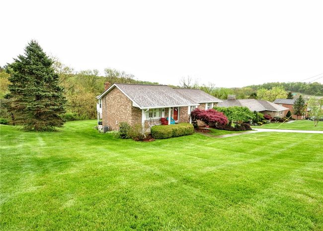 You have a nice front yard as well as back, she does have the grass treated, can't you tell! | Image 7
