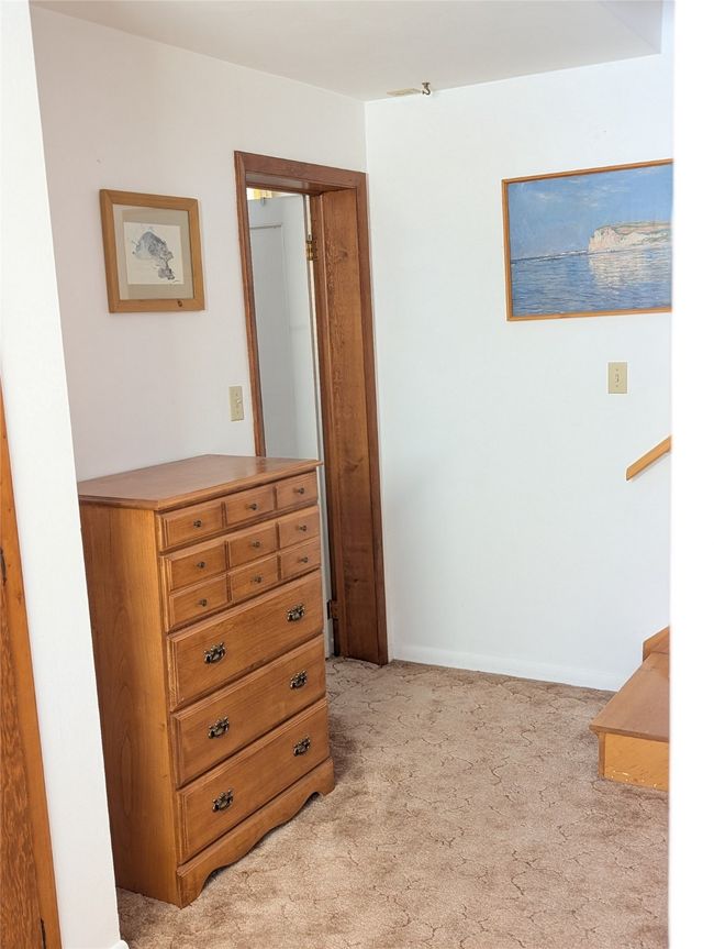 Hall featuring light colored carpet | Image 9