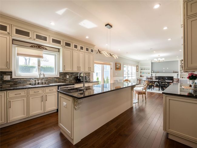 Kitchen with plenty of natural light, cream cabinetry, and a sink | Image 10