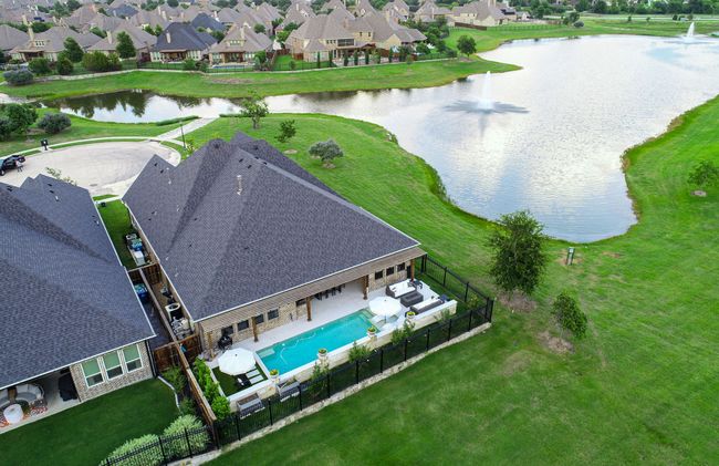 Aerial perspective showcasing premier location with a peaceful water views and backyard oasis | Image 4