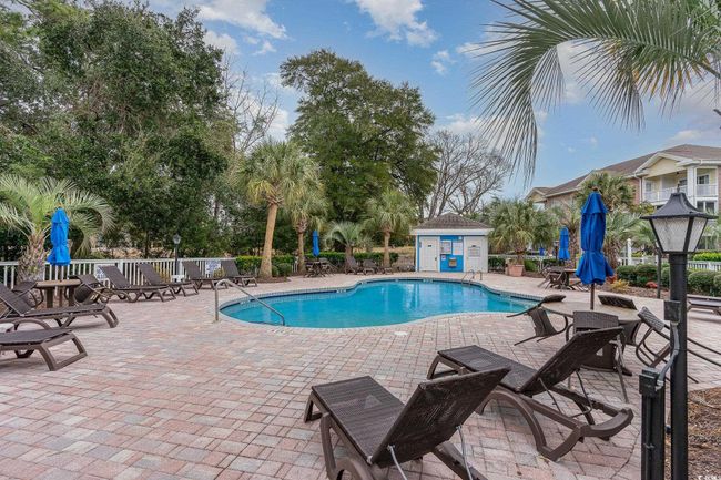 View of pool with a patio | Image 19