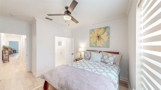 Bedroom featuring ornamental molding and light wood-type flooring | Image 26
