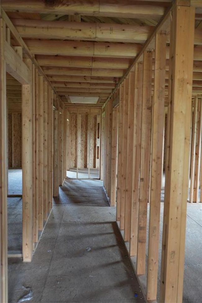 Hallway to Bedrooms and Utility Room with Attic Access Stairs | Image 15