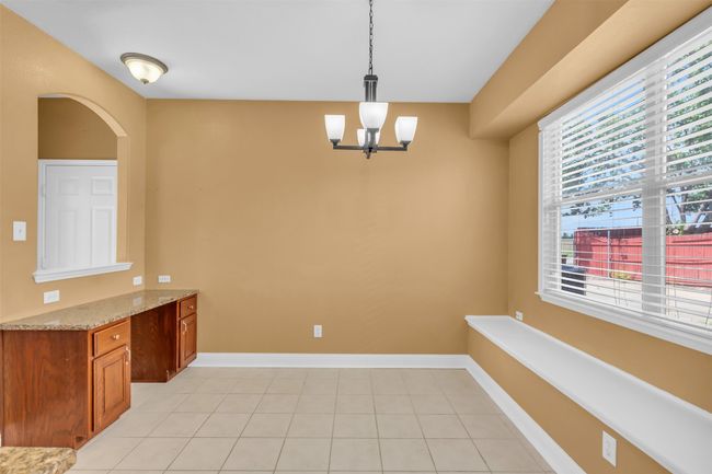 Breakfast area with seating area. | Image 9
