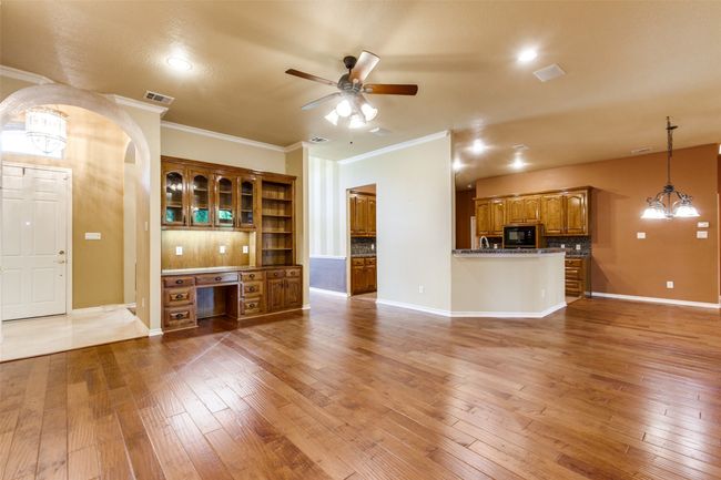 View of den looking into entryway. | Image 11