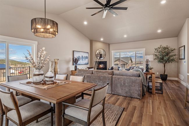 Dining room featuring lofted ceiling, recessed lighting, ceiling fan, wood finished floors, and baseboards | Image 37