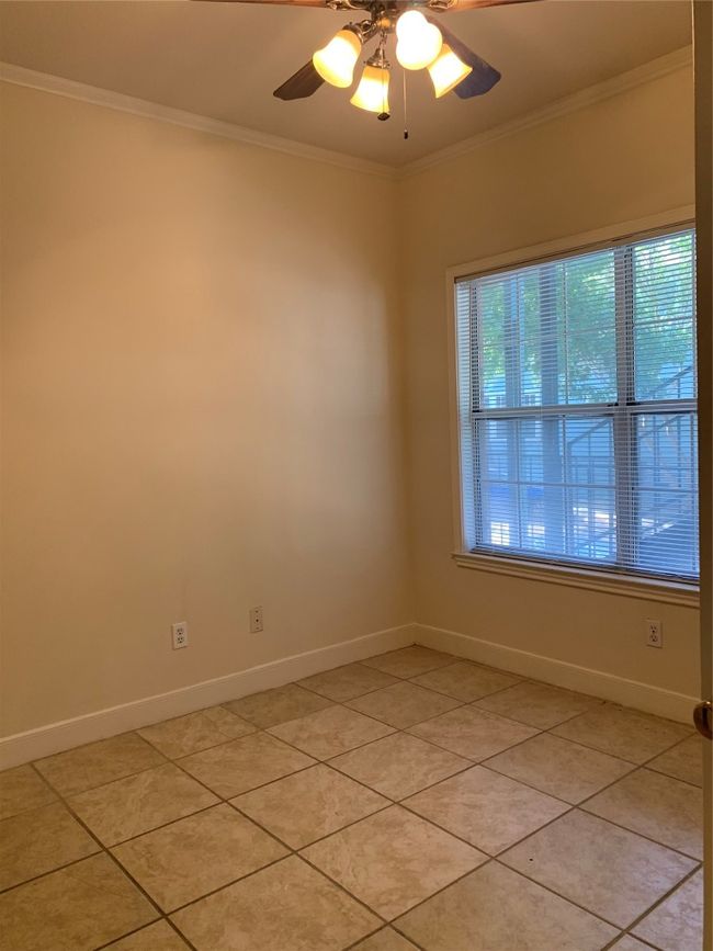 Unfurnished room featuring baseboards, light tile patterned floors, and crown molding | Image 7