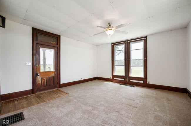 empty room featuring carpet and a ceiling fan | Image 6