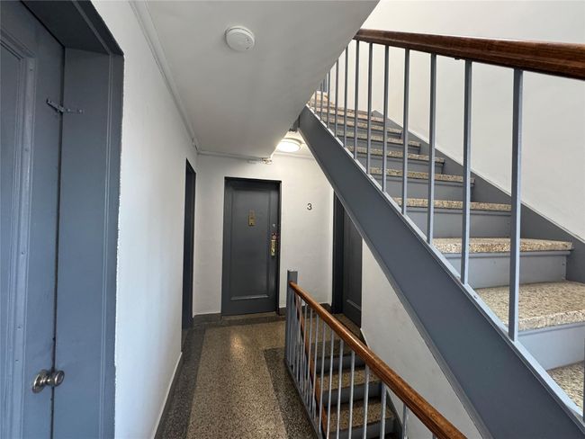 Stairway with elevator and speckled floor | Image 13