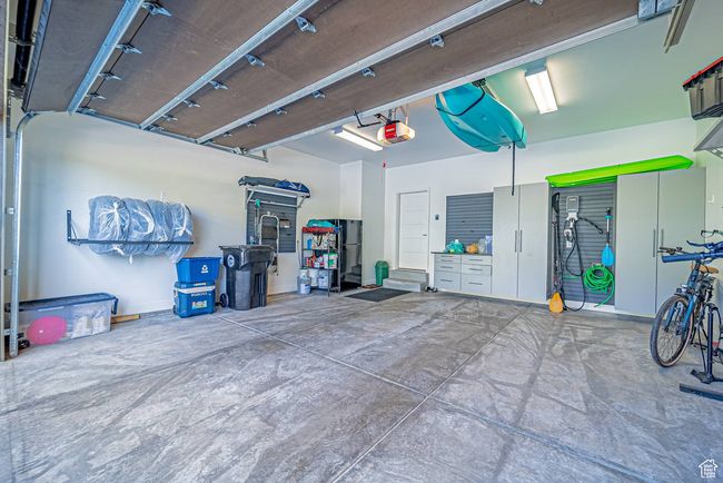 Garage featuring a garage door opener | Image 31