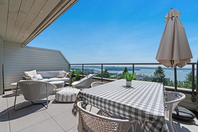 Patio / terrace featuring a water view and outdoor lounge area | Image 12