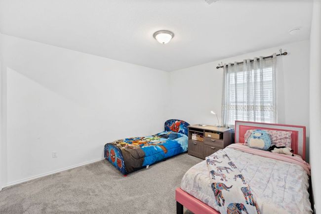 Carpeted bedroom featuring baseboards | Image 26