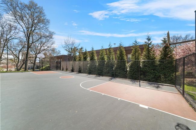 View of basketball court featuring fence and community basketball court | Image 7