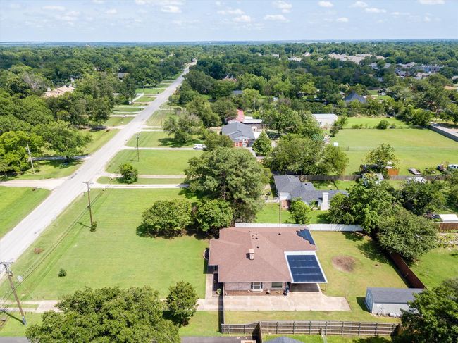 Aerial view that reflects the spaciousness of this property with private backyard that is fully fenced. FYI...solar panels are being removed. | Image 32