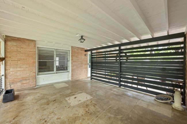 The wood paneling separates the back and front porches. | Image 22