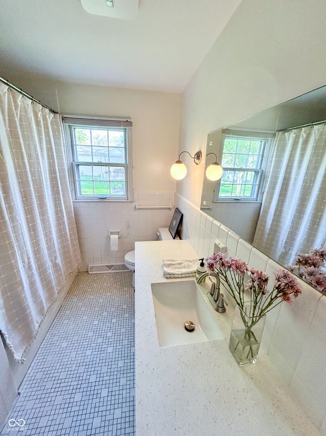 Full bathroom with ceramic tile and stone vanity top | Image 18