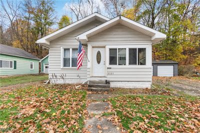 Bungalow-style house with an outbuilding and a garage | Image 1