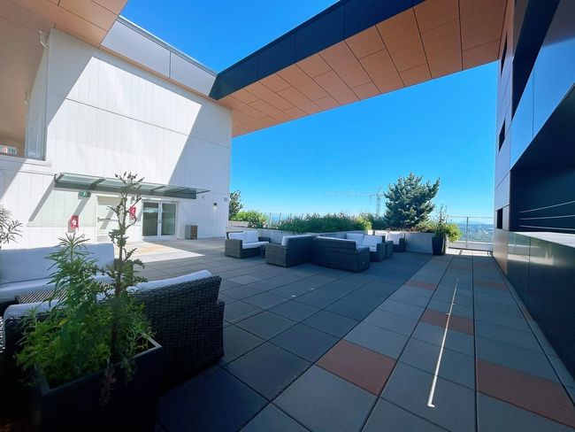 View of patio with an outdoor hangout area | Image 19