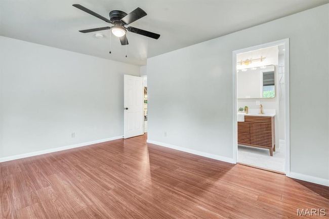 Wooden terrace featuring a ceiling fan and a yard | Image 22