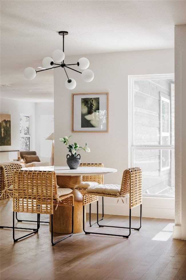 Dining space with wood finished floors and a chandelier | Image 4