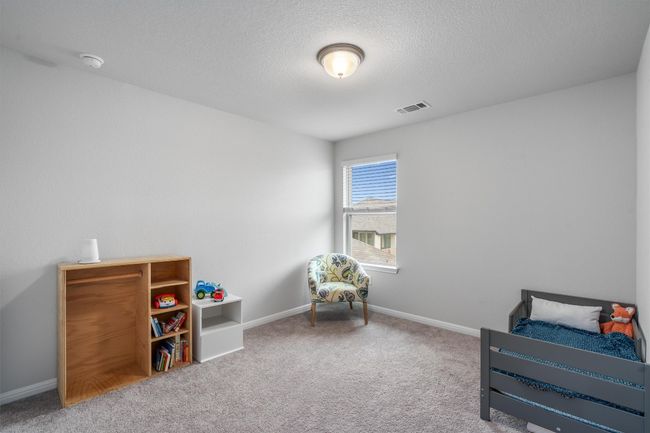 Sitting room with carpet floors, baseboards, and a textured ceiling | Image 25